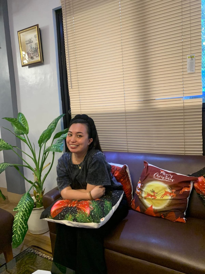 Liezl Villanueva Obedencio sitting at a restaurant